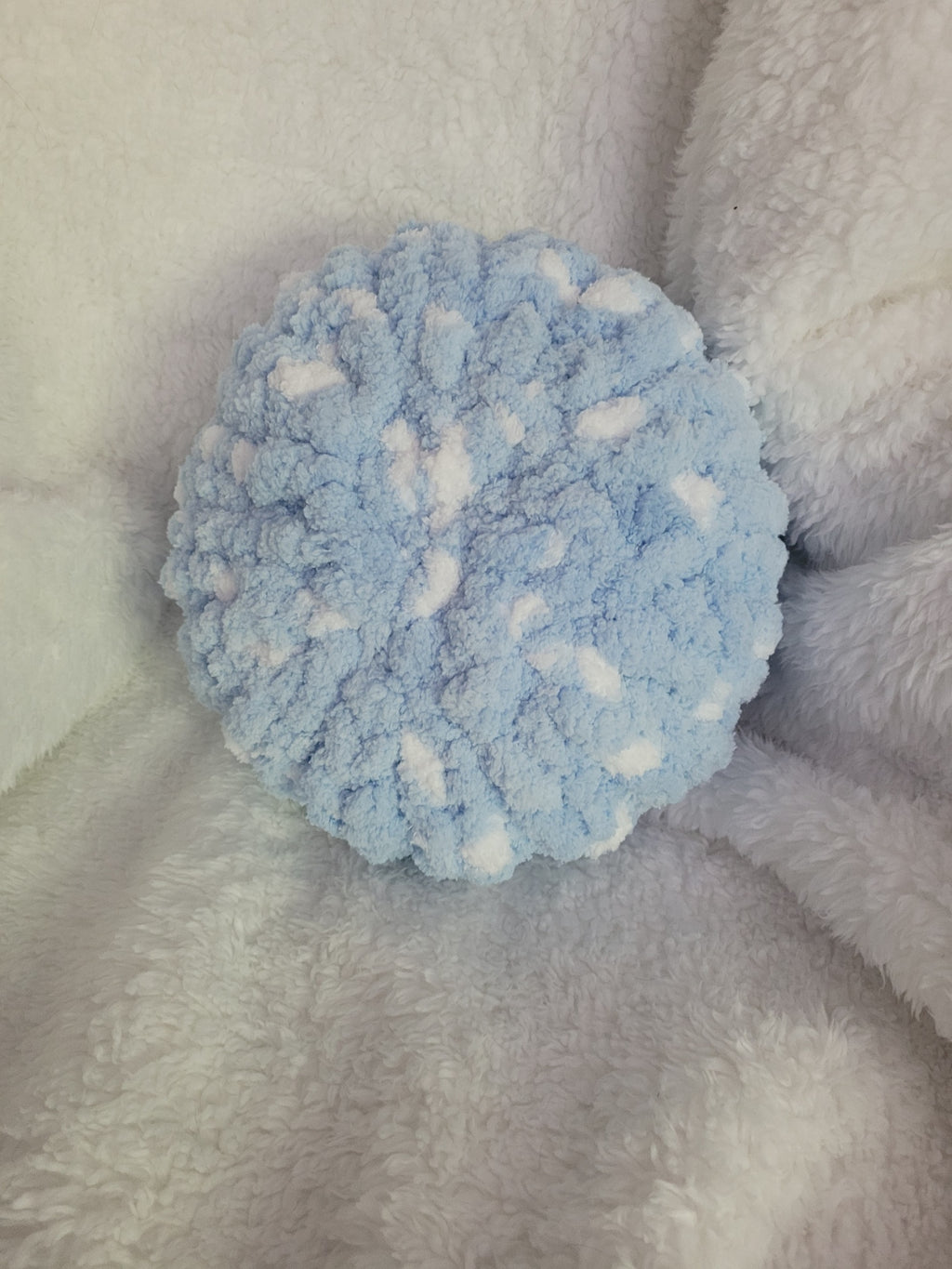Handmade white round chunky chenille pillow with blue accents