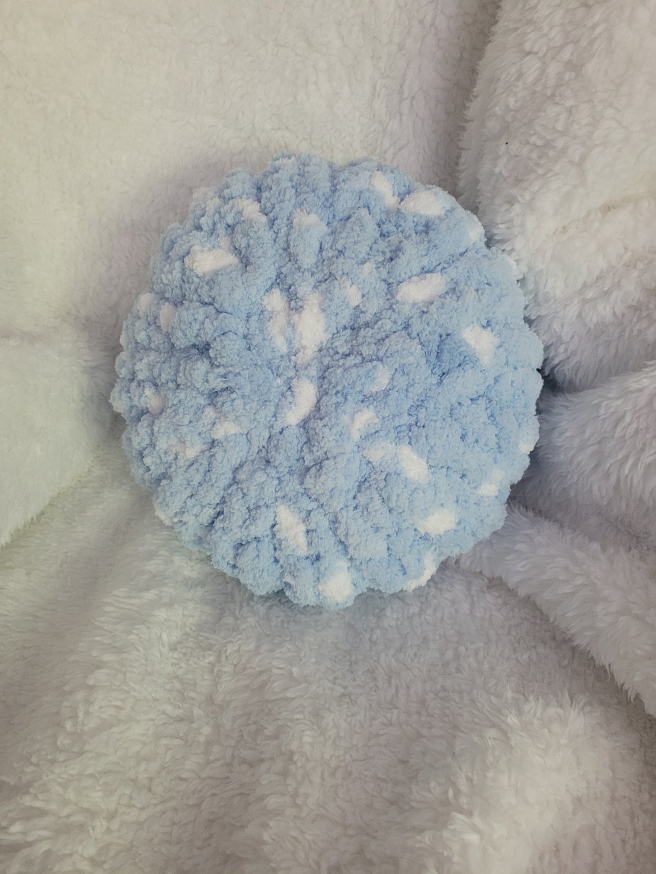 Handmade white round chunky chenille pillow with blue accents