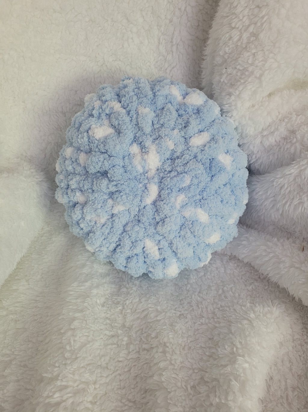 Handmade white round chunky chenille pillow with blue accents