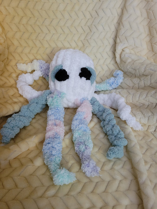 Handmade ghost octopus plush named Casper with spa‑blue shading and pastel legs.