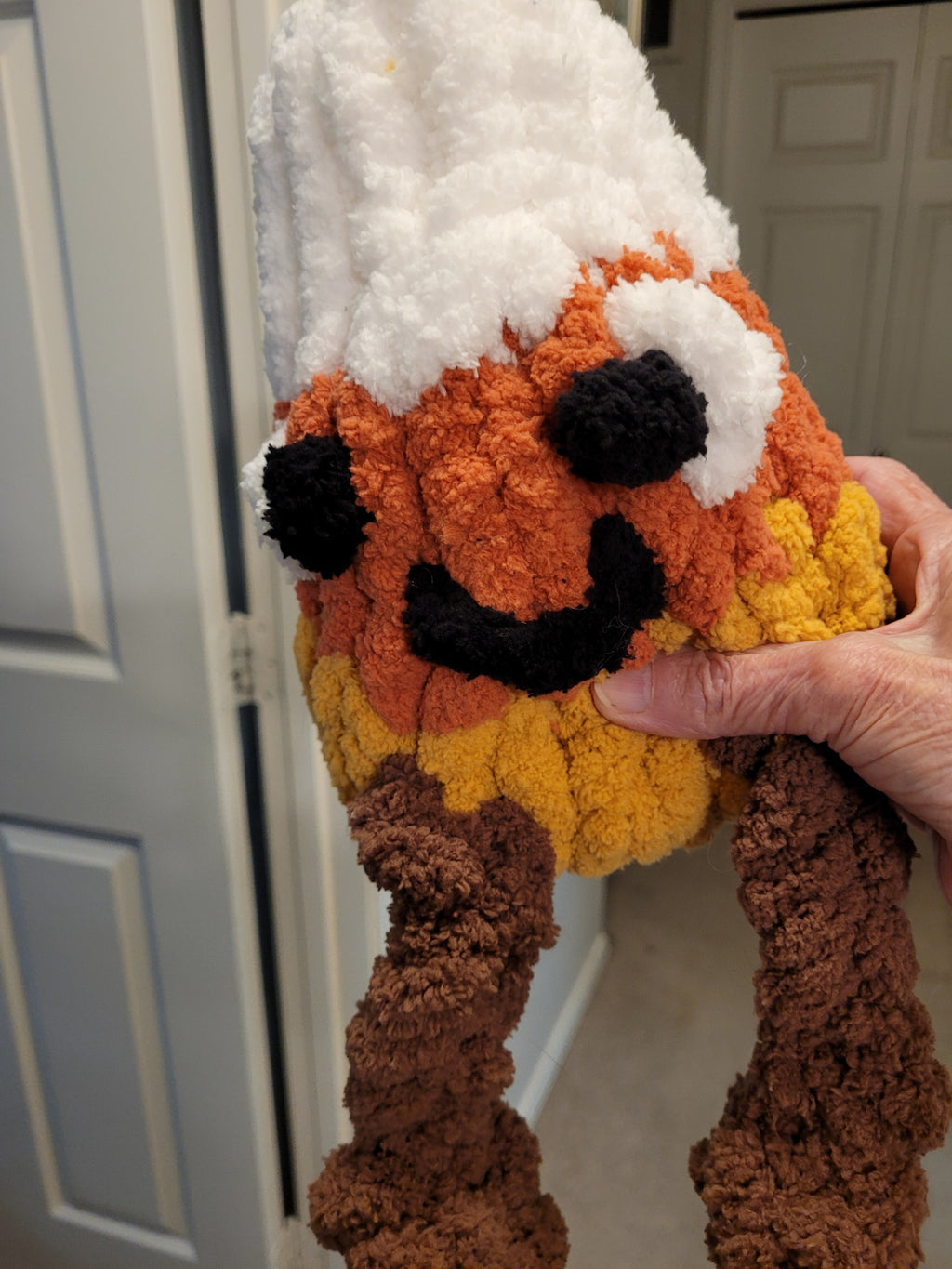 close‑up showing his smile, eyes, and knotted legs