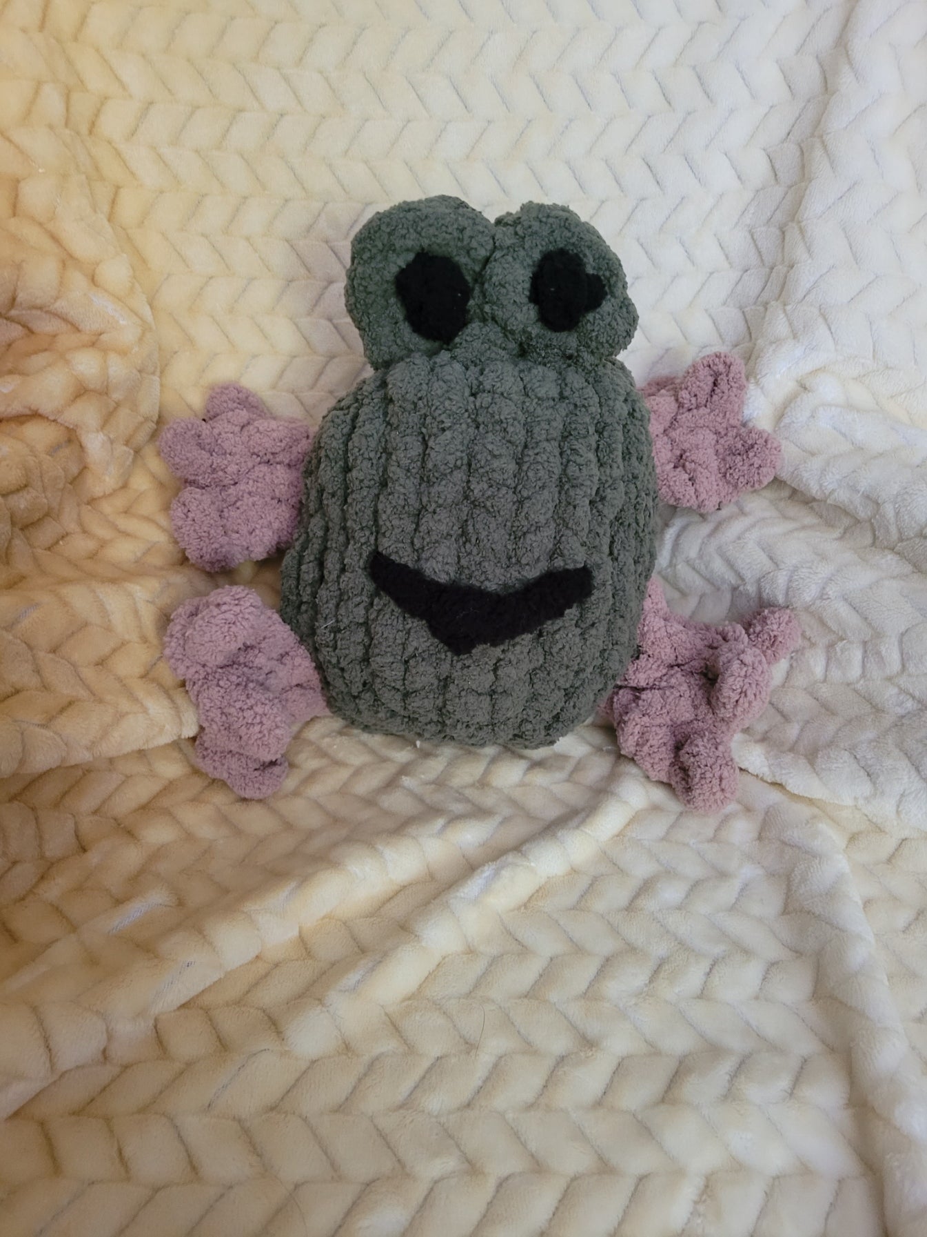 Froodle the frog plush sitting upright with raised eyes