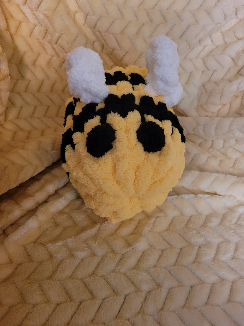 Handmade chunky‑chenille bumble bee plush with soft wings and striped body.