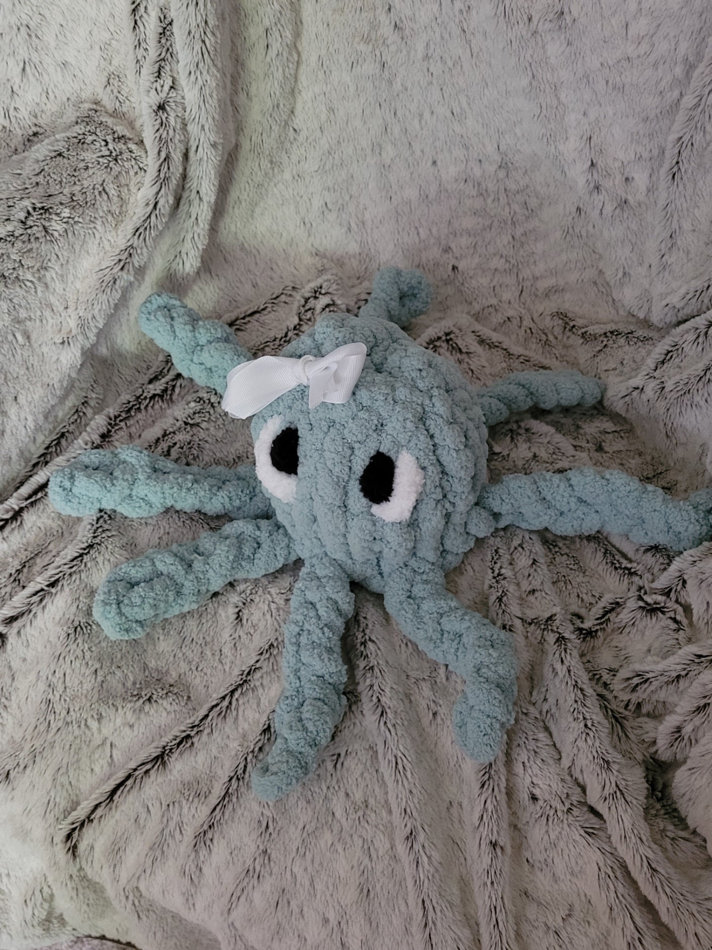 Spa blue octopus plush showing all eight tentacles