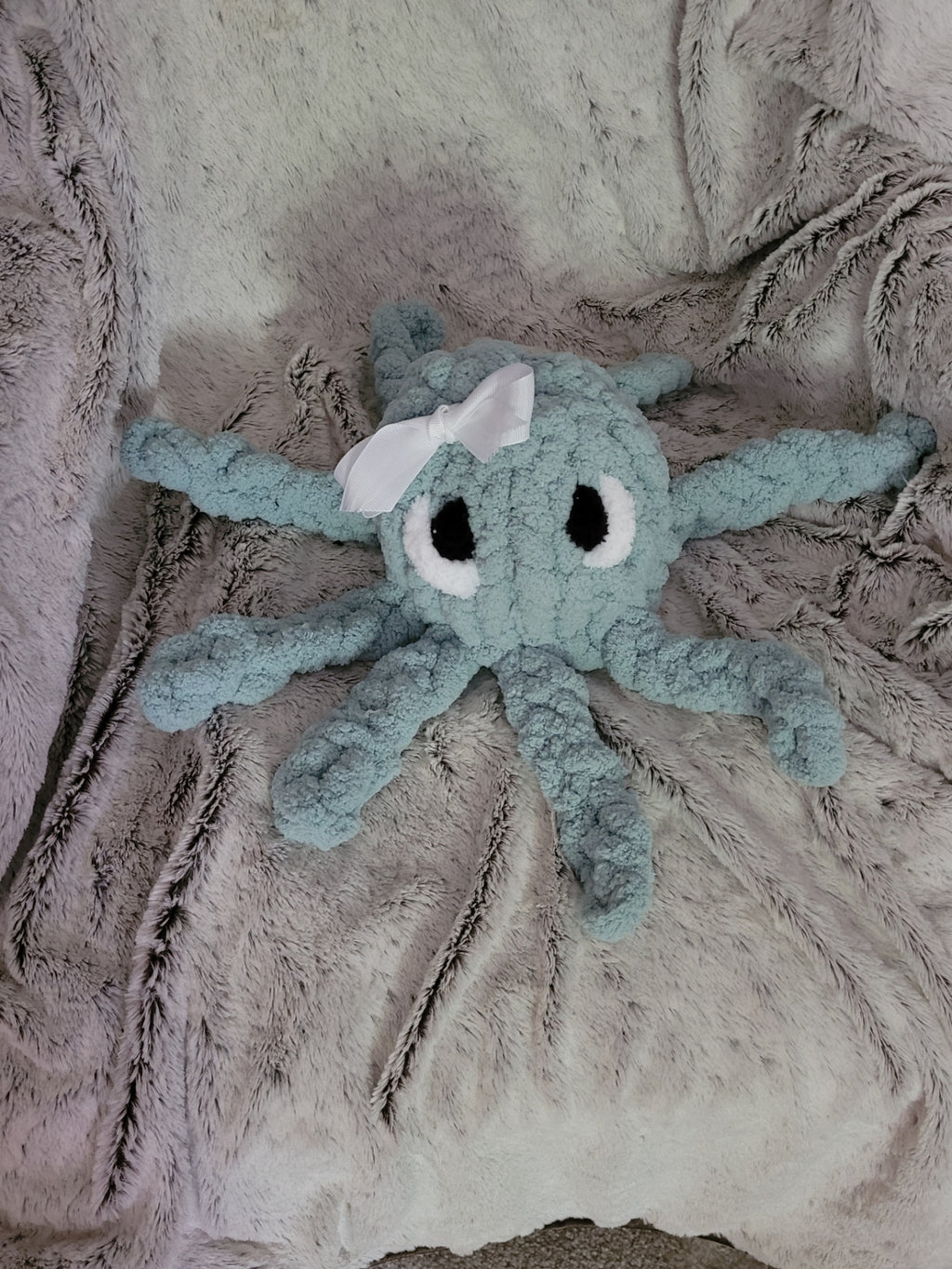 andmade octopus plush with outlined eyes
