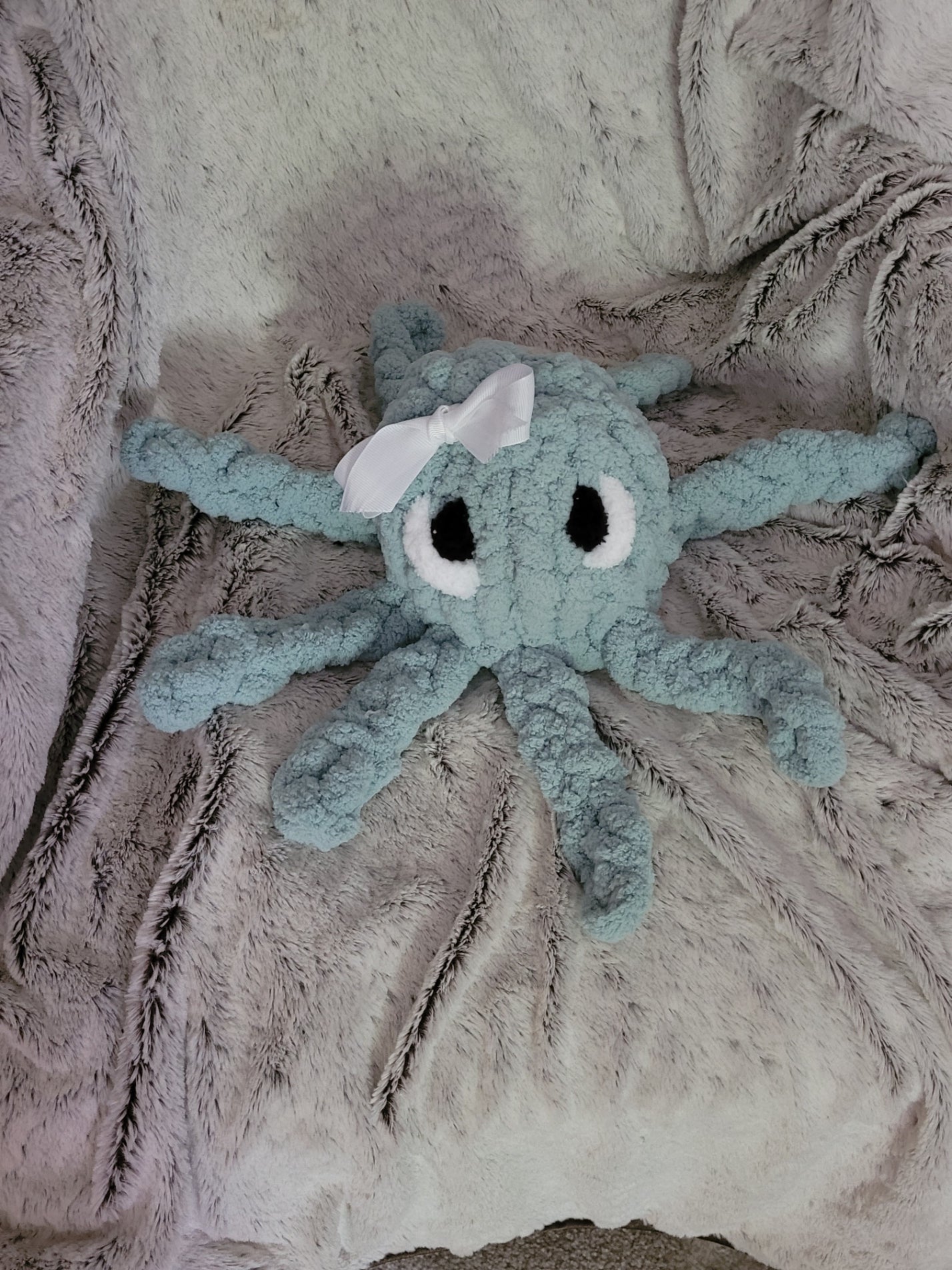 andmade octopus plush with outlined eyes