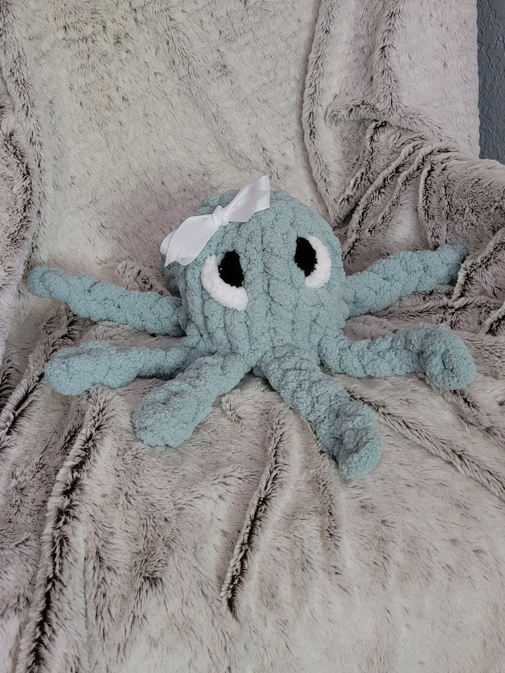 Spa‑blue octopus plush with white bow