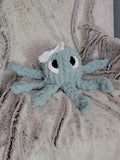 Spa‑blue octopus plush with white bow