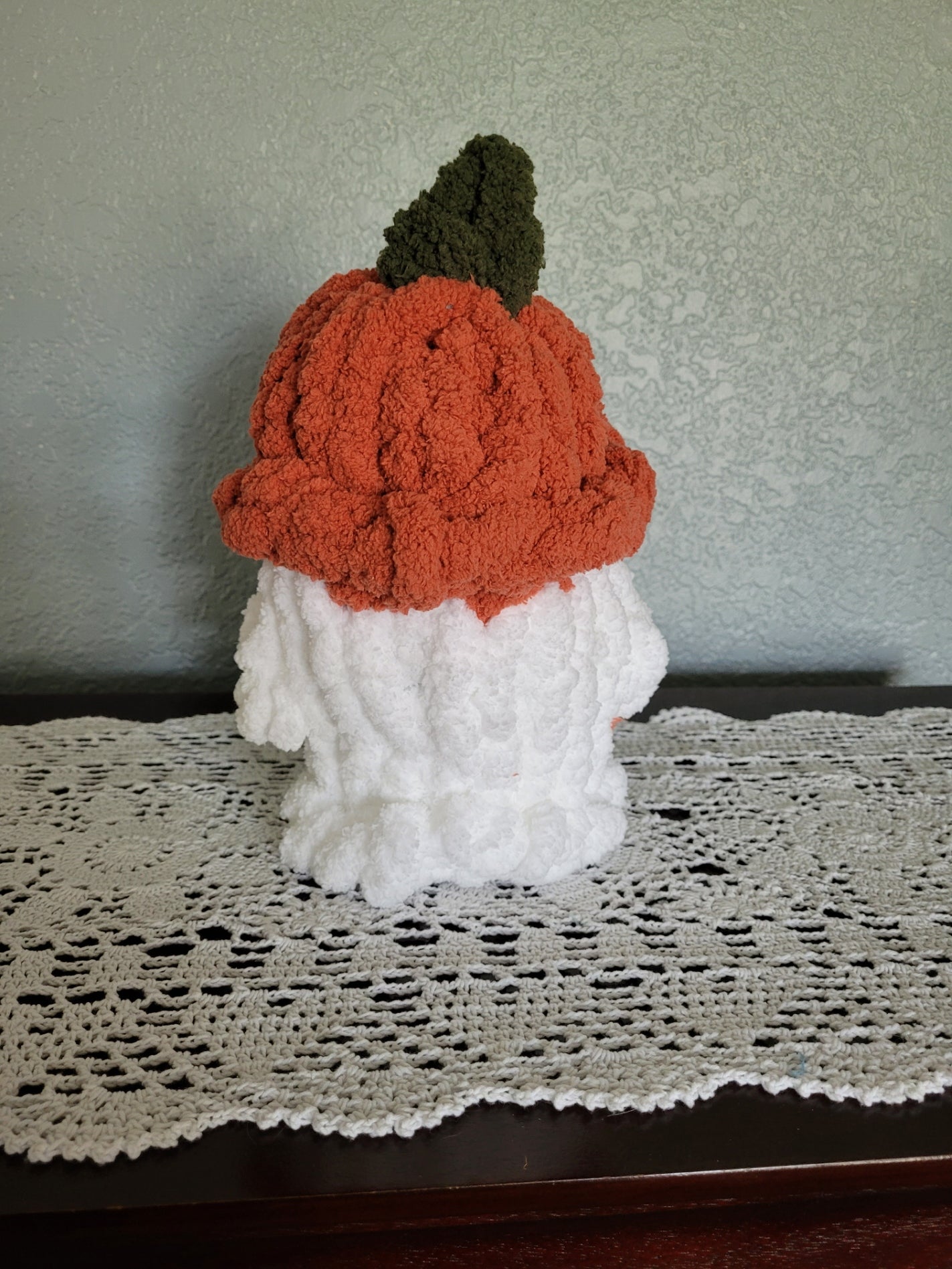 Back view of handmade ghost plush with pumpkin hat — showing full hat shape and smooth body.