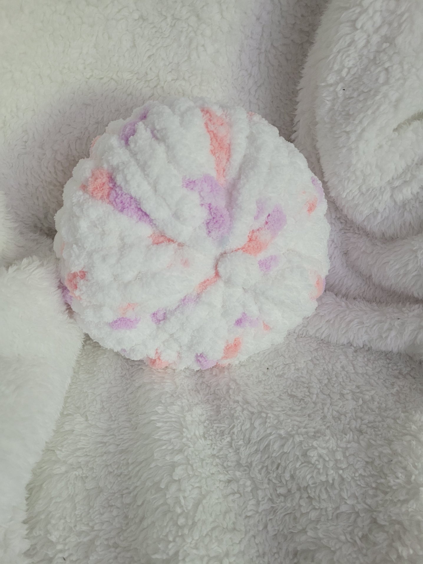 Handmade white round chunky chenille pillow with pink and lilac accents