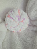 Handmade white round chunky chenille pillow with pink and lilac accents